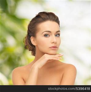 health and beauty, green, eco, bio concept - face and hands of beautiful woman with updo (can be used as a template for jewelry)