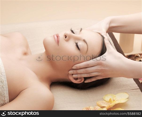 health and beauty, resort and relaxation concept - asian woman in spa salon getting massage