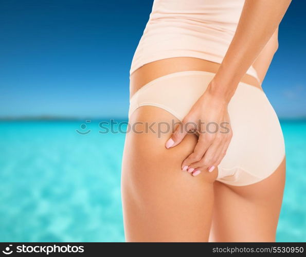 health and beauty - woman in cotton underwear showing slimming concept