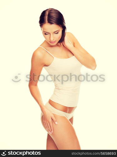 health and beauty - woman in cotton underwear showing slimming concept