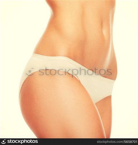 health and beauty - woman in cotton underwear showing slimming concept
