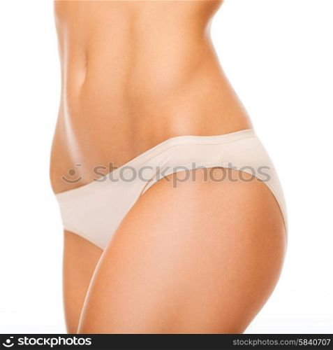health and beauty - woman in cotton underwear showing slimming concept. woman in cotton underwear showing slimming concept