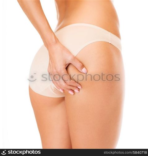 health and beauty - woman in cotton underwear showing slimming concept. woman in cotton underwear showing slimming concept