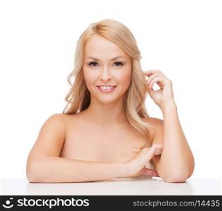 health and beuty concept - beautiful woman playing with long hair