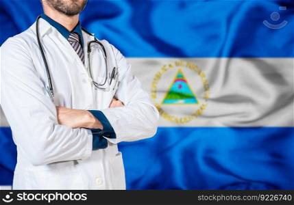Health and care with the flag of Nicaragua. Nicaragua national health concept, Doctor with stethoscope on Nicaragua flag. Doctor arm holding stethoscope on nicaragua flag