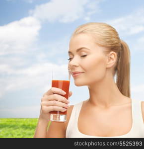 health and diet concept - close up of young woman drinking tomato juice