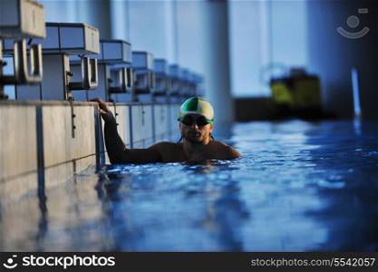 health and fitness lifestyle concept with young athlete swimmer recreating on olimpic pool