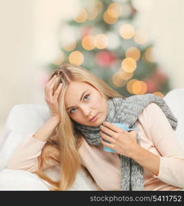 health and illness concept - indoor picture of diseased woman with cup of tea