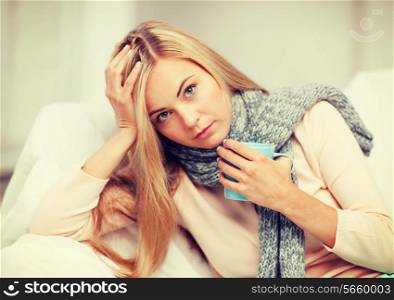 health and illness concept - indoor picture of diseased woman with cup of tea