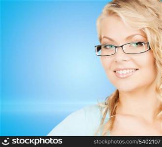health and vision concept - close up of beautiful young woman wearing eyeglasses