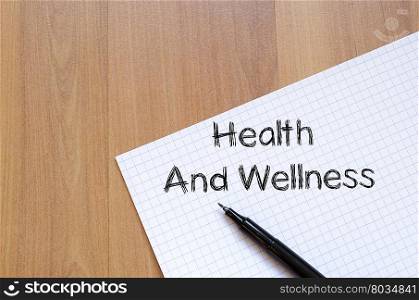 Health and wellness text concept write on notebook