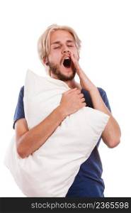 Health balance sleep deprivation concept. Sleepy tired guy holding pillow and yawning. Health balance sleep deprivation concept. Male student or worker with lack of slumber, isolated on white. Sleepy young man holding white pillow