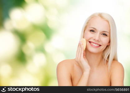 health, beauty and spa concept - beautiful woman with sponge