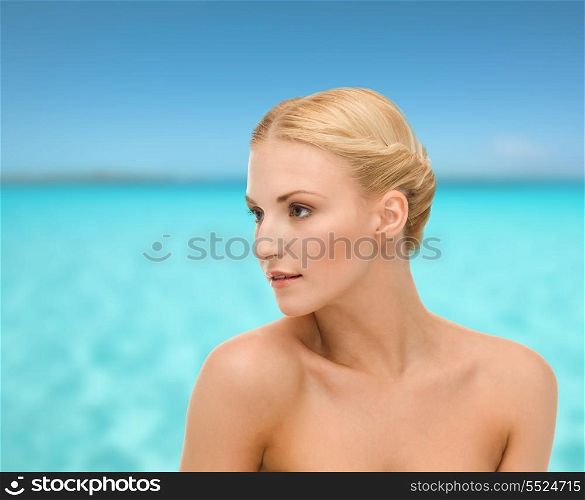 health, beauty and spa concept - close up of clean face of beautiful young woman