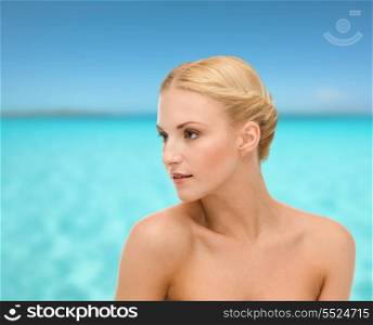 health, beauty and spa concept - close up of clean face of beautiful young woman