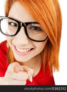 health, beauty, business concept - woman in glasses pointing finger