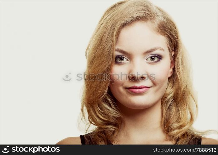 Health beauty concept - portrait beautiful woman face with makeup and long blond hair
