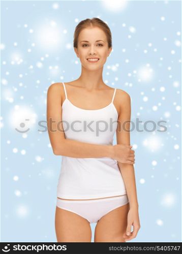 health, beauty, spa and happiness concept - beautiful woman in white cotton undrewear