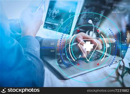 Health care and medical services with circular AR diagram.Doctor working with digital tablet and laptop computer with smart phone in medical workspace office and video conferance as concept