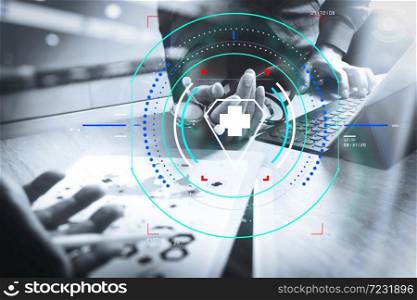 Health care and medical services with circular AR diagram.Doctor hand working smart phone modern digital tablet dock keyboard. laptop computer graphics chart interface