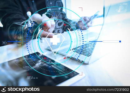 Health care and medical services with circular AR diagram.Doctor hand working with modern digital tablet and laptop computer with medical chart interface