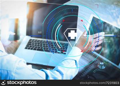 Health care and medical services with circular AR diagram.doctor hand working with modern digital tablet and laptop computer with smart phone as medical network concept