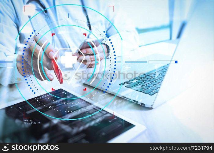 Health care and medical services with circular AR diagram.Medical technology concept. Doctor hand working with modern digital tablet and laptop computer with medical chart interface