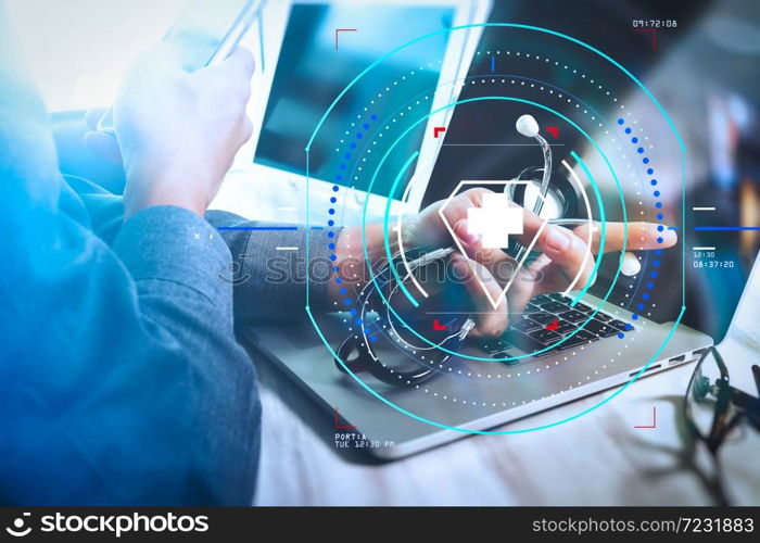 Health care and medical services with circular AR diagram.Medical technology concept. Doctor hand working with modern digital tablet and laptop computer