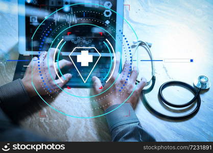 Health care and medical services with circular AR diagram.Medical technology concept. Doctor hand working with modern digital tablet dock screen computer with medical chart interface