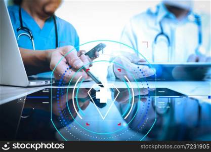 Health care and medical services with circular AR diagram.Medical technology network team concept. Doctor hand working with smart phone modern digital tablet and laptop computer