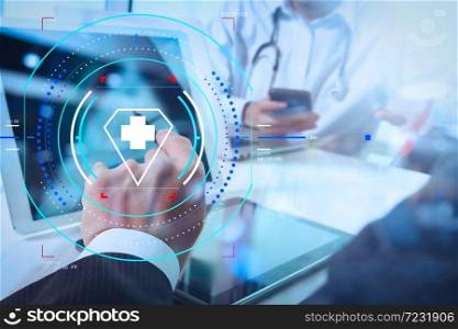 Health care and medical services with circular AR diagram.Medical technology network team concept. Doctor hand working with smart phone modern digital tablet and laptop computer