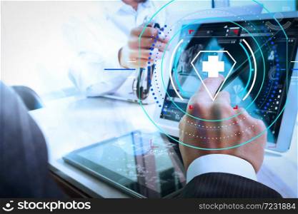 Health care and medical services with circular AR diagram.Medical technology network team meeting concept. Doctor hand working with smart phone modern digital tablet and laptop computer