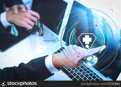 Health care and medical services with circular AR diagram.Medical technology network team meeting concept. Doctor hand working smart phone modern digital tablet laptop computer graphics chart interface.