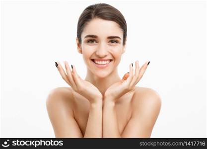 Health care and spa concept - attractive young and healthy woman with nude makeup on white background. Health care and spa concept - attractive young and healthy woman with nude makeup on white background.