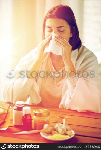 health care, flu, hygiene, age and people concept - sick woman with medicine blowing nose to paper wipe at home. sick woman with medicine blowing nose to wipe