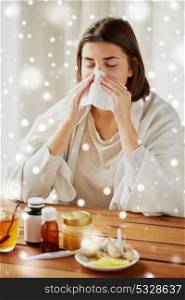 health care, flu, hygiene, age and people concept - sick woman with medicine blowing nose to paper wipe at home over snow. sick woman with medicine blowing nose to wipe