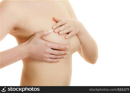 Health care medical concept. Young woman examining her breasts for lumps or signs of breast cancer isolated on white. Woman examining her breasts for breast cancer