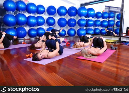 health club: women doing stretching, fitness, aerobics and yoga exercise