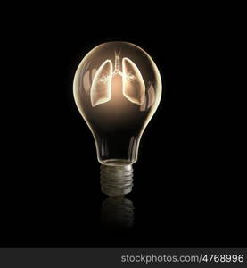 Health concept. Light bulb with lungs on black bakground