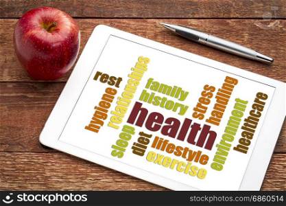 health concept - word cloud on a digital tablet with apple
