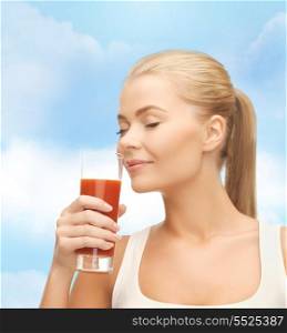 health, diet and food concept - close up of young woman drinking tomato juice