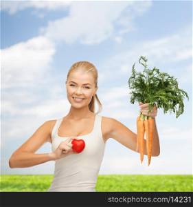 health, diet and food concept - young woman holding heart symbol and carrots