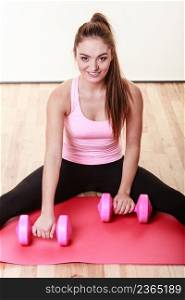 Health fitness sport shape concept. Cheerful girl lifting weights. Young attractive lady holding dumbbells exercising.. Cheerful girl liftingweights