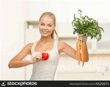 health, food and diet concept - young woman holding heart symbol and carrots