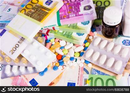 Health insurance concept with pills and money. Medicine cost