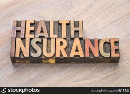 health insurance word abstract in in vintage letterpress wood type