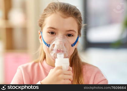 health, medical equipment and people concept - sick little girl wearing oxygen mask. sick little girl wearing oxygen mask