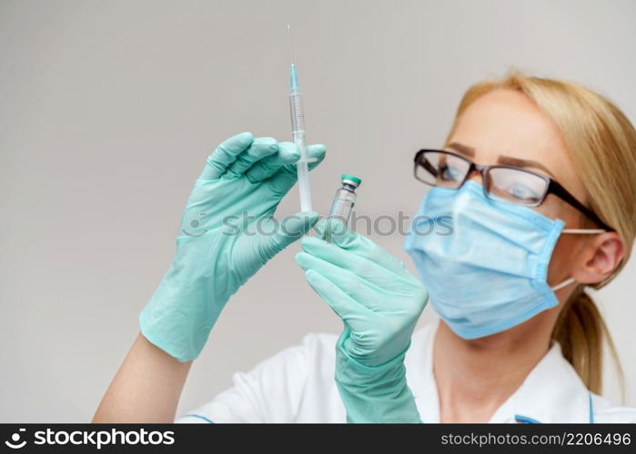 health medical worker woman holding vaccine and syringe.. health medical worker woman holding vaccine and syringe