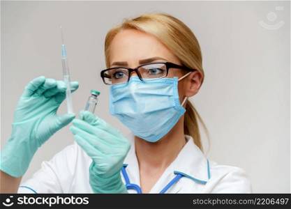 health medical worker woman holding vaccine and syringe.. health medical worker woman holding vaccine and syringe