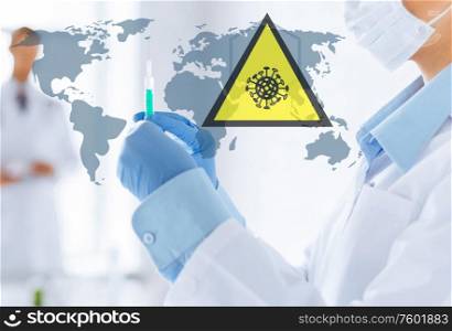 health, medicine and pandemic concept - doctor wearing protective medical mask with syringe over world map and coronavirus caution sign. doctor with syringe over coronavirus pandemic map